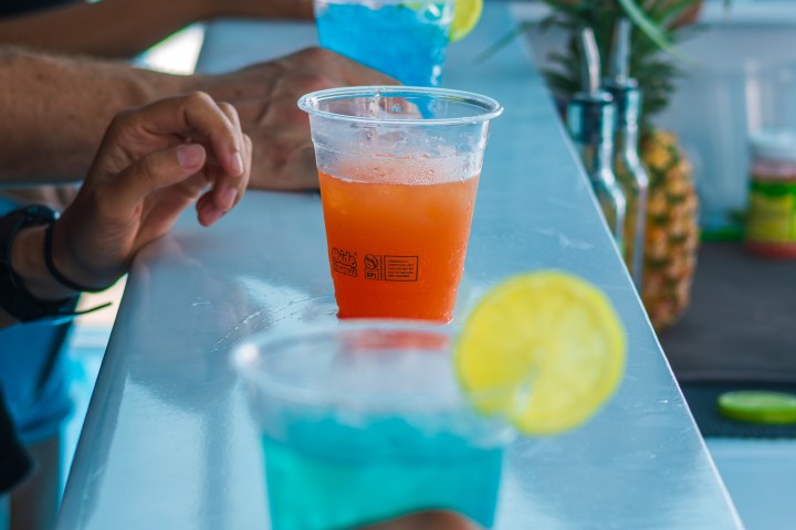 a group of people sitting at a table eating food