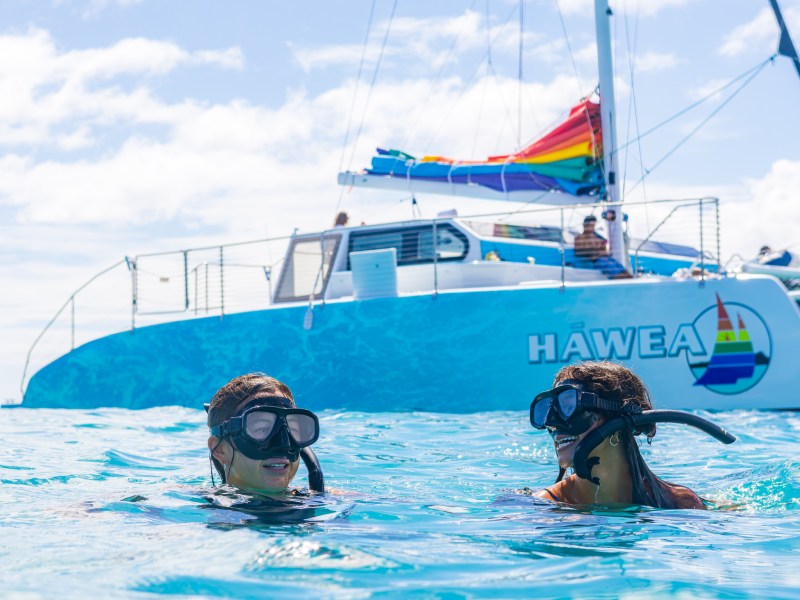 a group of people riding on the back of a boat