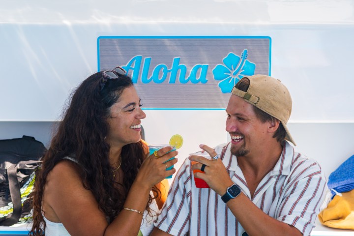 a man and a woman eating a hot dog