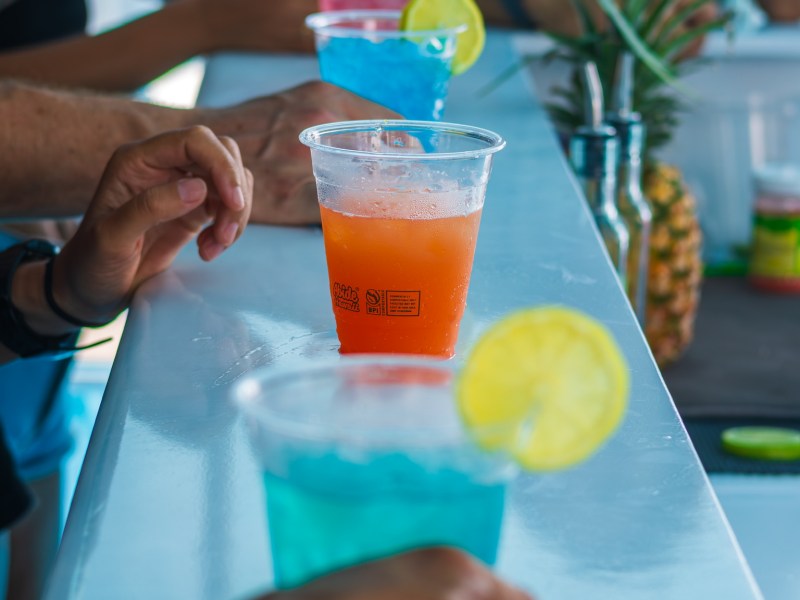 a group of people sitting at a table eating food