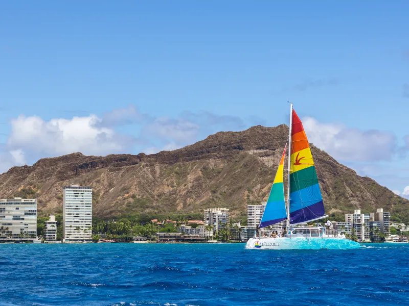 a large body of water with a mountain in the background