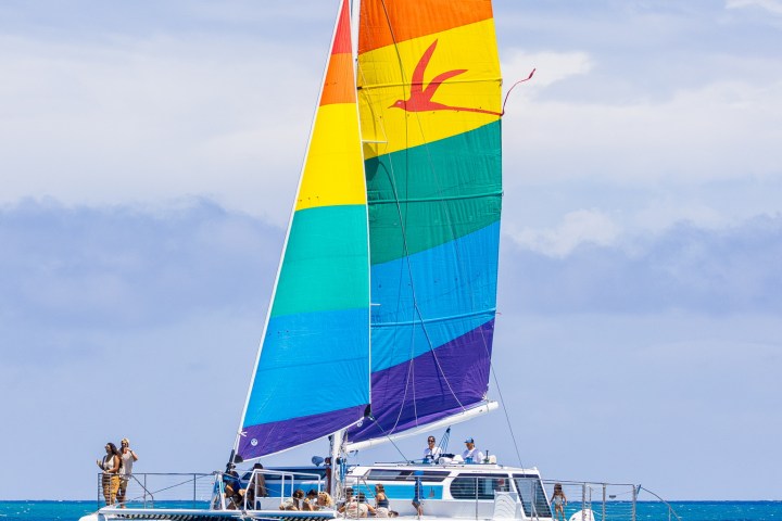 a large blue boat sitting next to a body of water