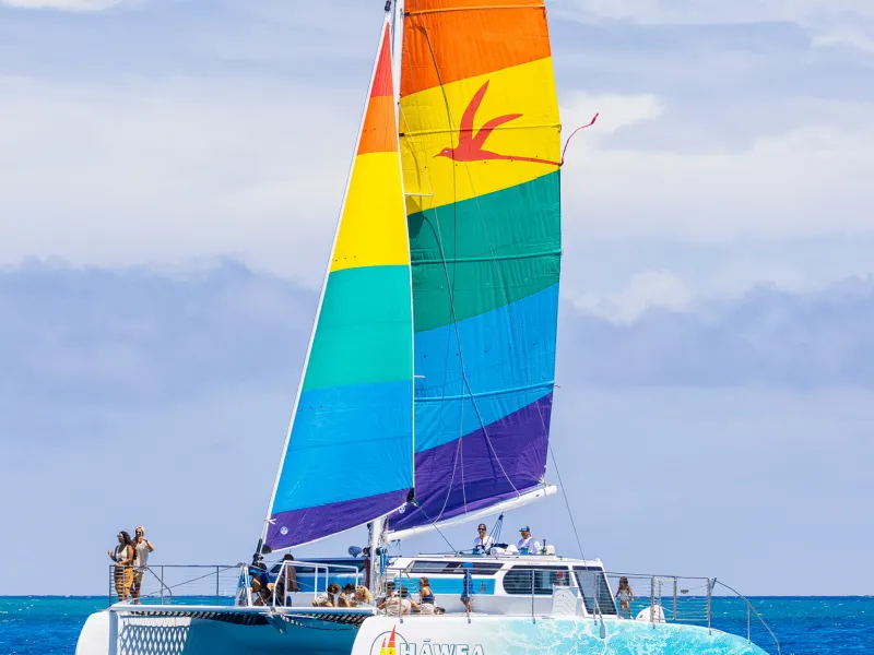 a large blue boat sitting next to a body of water