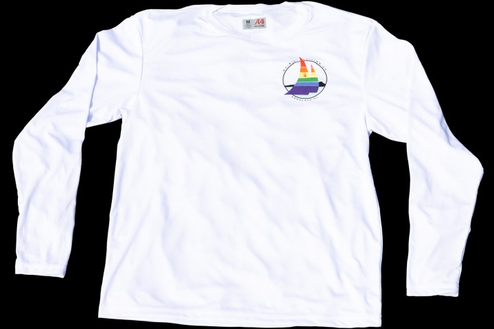 White long-sleeve shirt with multicolored sailboat logo on chest.